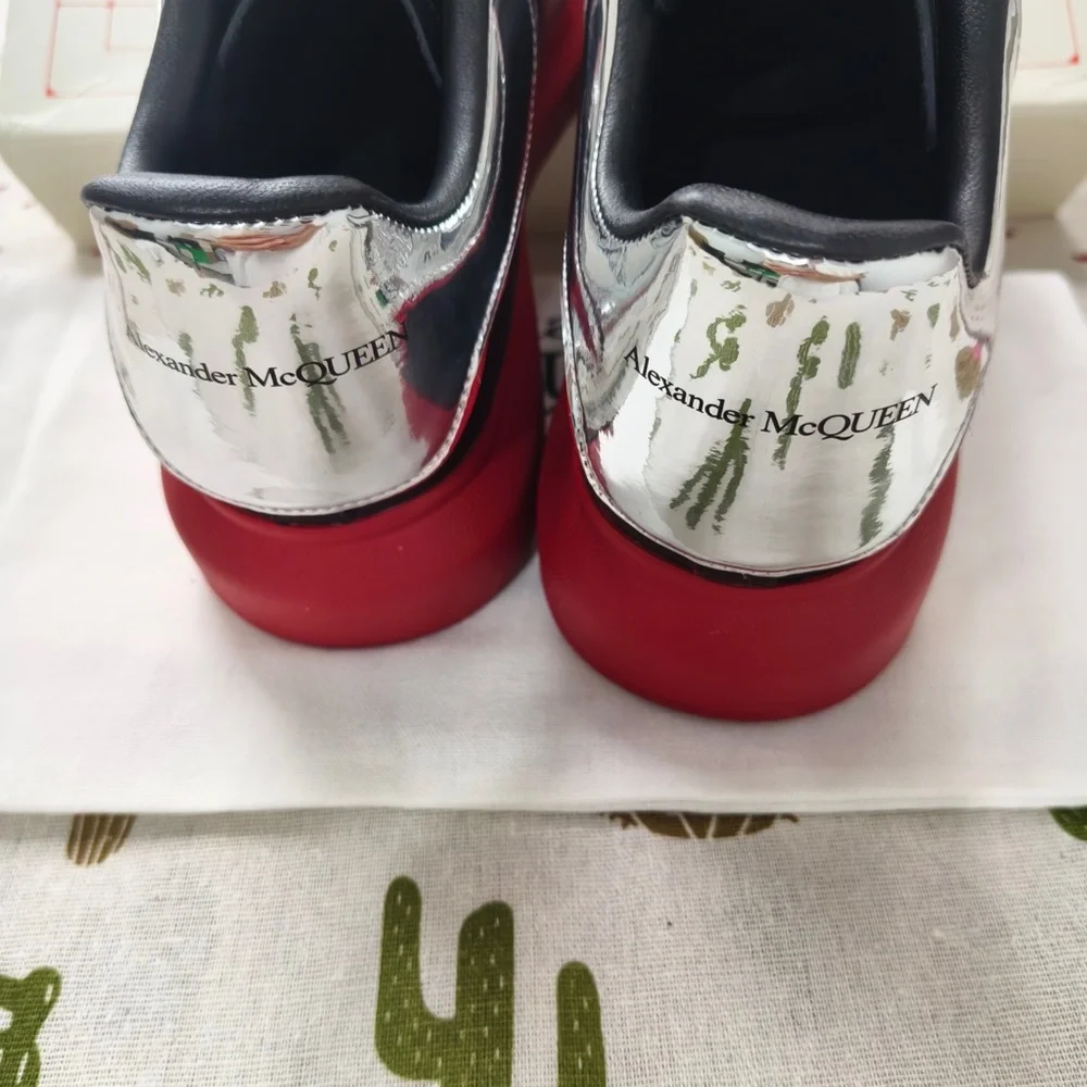 Alexander McQueen Black Leather Sneakers with Red Soles